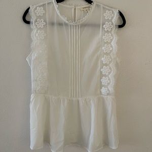White blouse with flower details.